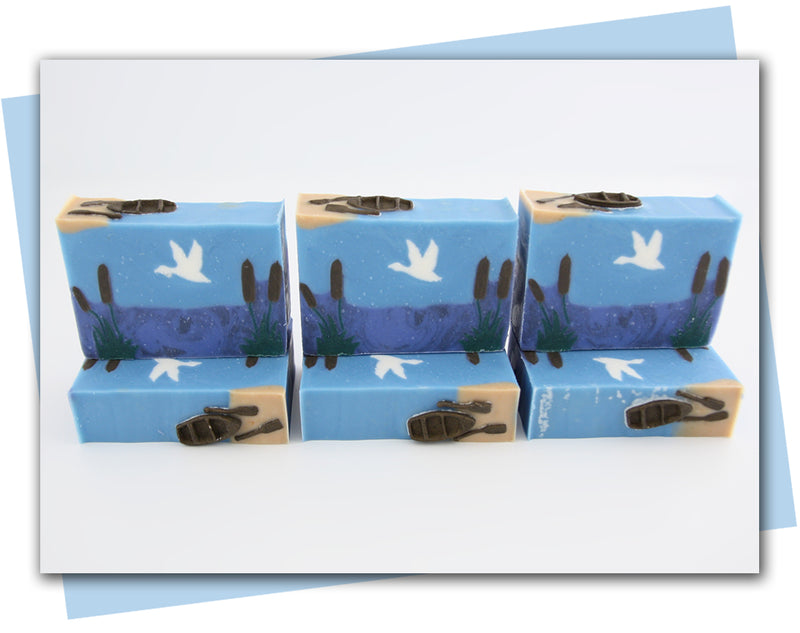 lake scene with lake cattails, sky and flying geese handmade soap
