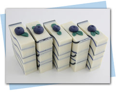 white soap with blue waves and blueberry embed on top