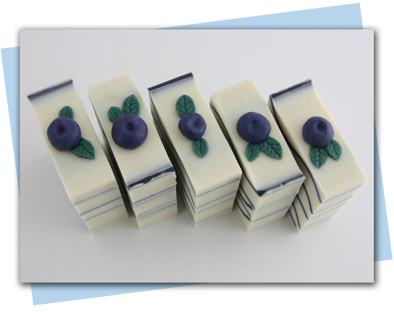 white soap with blue waves and blueberry embed on top