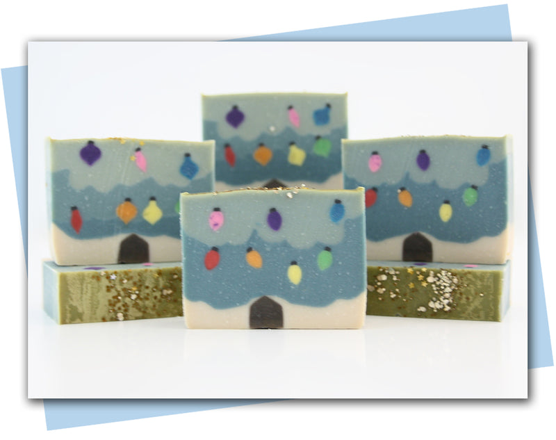 bars of soap made to look like a christmas tree with lights and ornaments