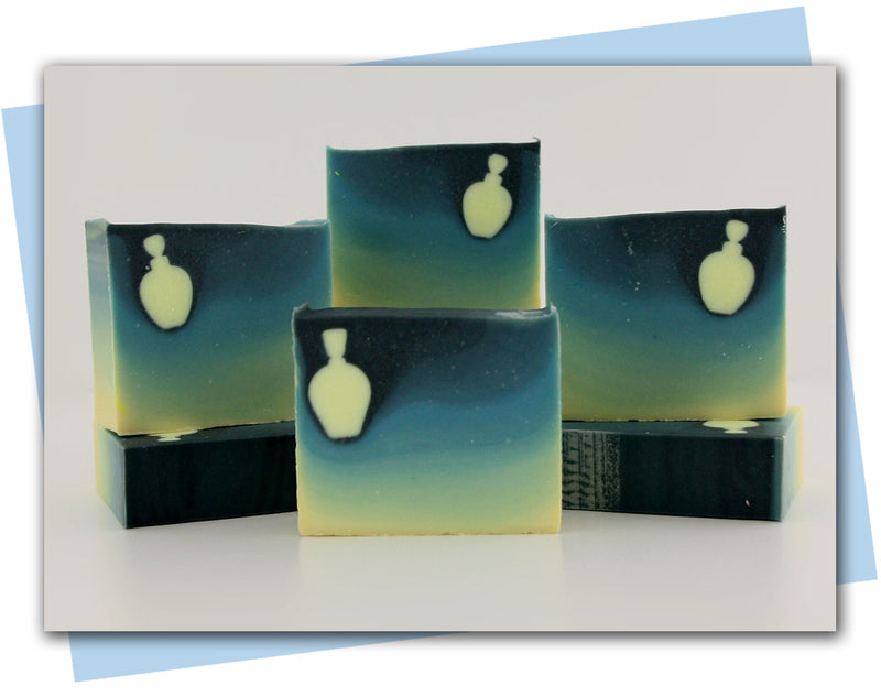 ombre soap from yellow to teal with a perfume bottle embed