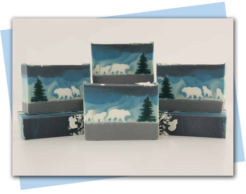 polar bear family trekking through the snow with yellow to blue ombre sky bar soap