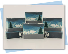 polar bear family trekking through the snow with yellow to blue ombre sky bar soap