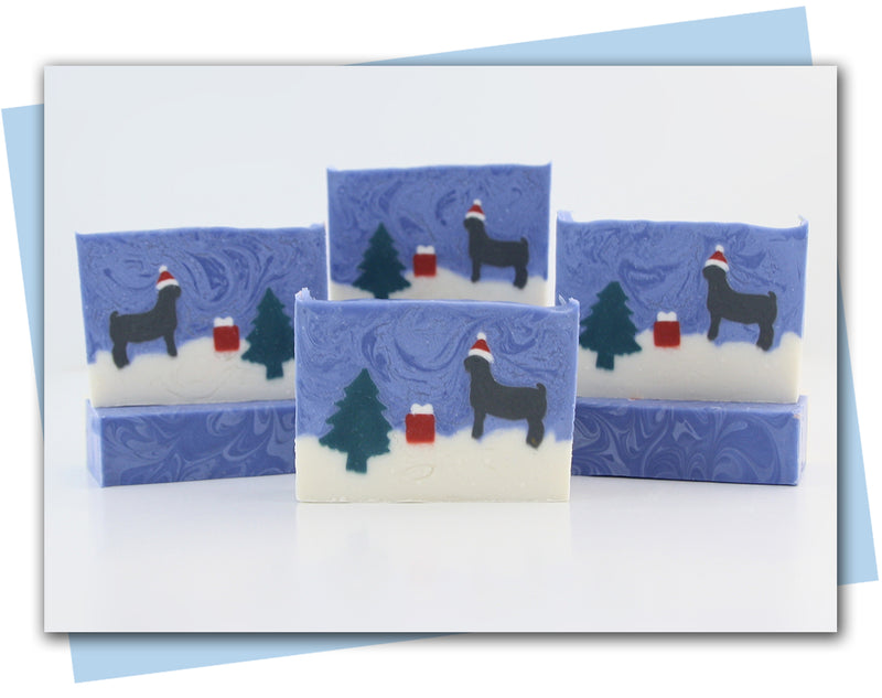 A winter scene with a goat wearing a santa hat bars of soap