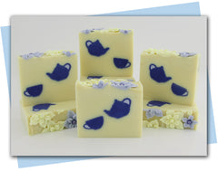 pale yellow soap base with dark blue teapot and tea cup embeds