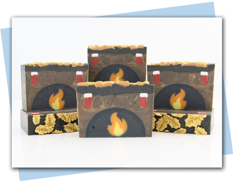 bars of soap made to look like a fireplace mantel with stockings hanging over it