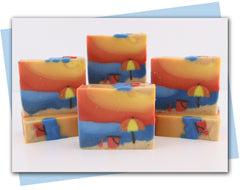 Beach sunset soap with beach umbrella and pail and shovel sitting in sand