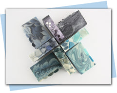 ombre swirls soap in tones of dark blue to light blue with blue ombre stone soap embellishments