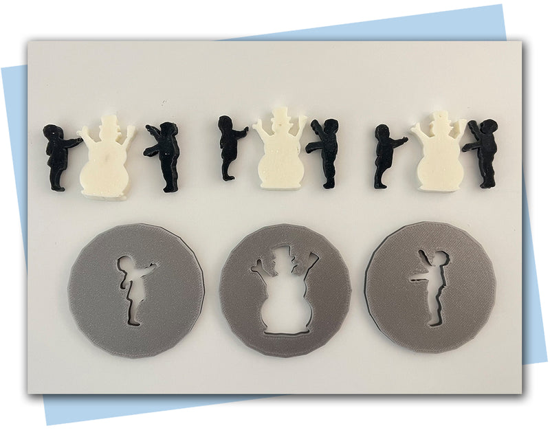 A girl and a boy building a snow man extruder disc set