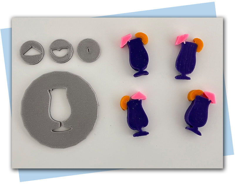 large cocktail extruder disc with fun umbrella and orange slice