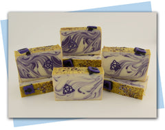 purple and white bars of soap with spell book embellishment