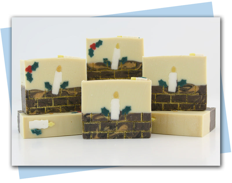 bars of soap with a brick fireplace mantle and a candle sitting on top