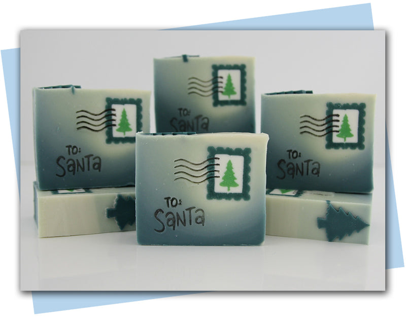 bar of soap that looks like a letter with a tree postage stamp and to santa stamp