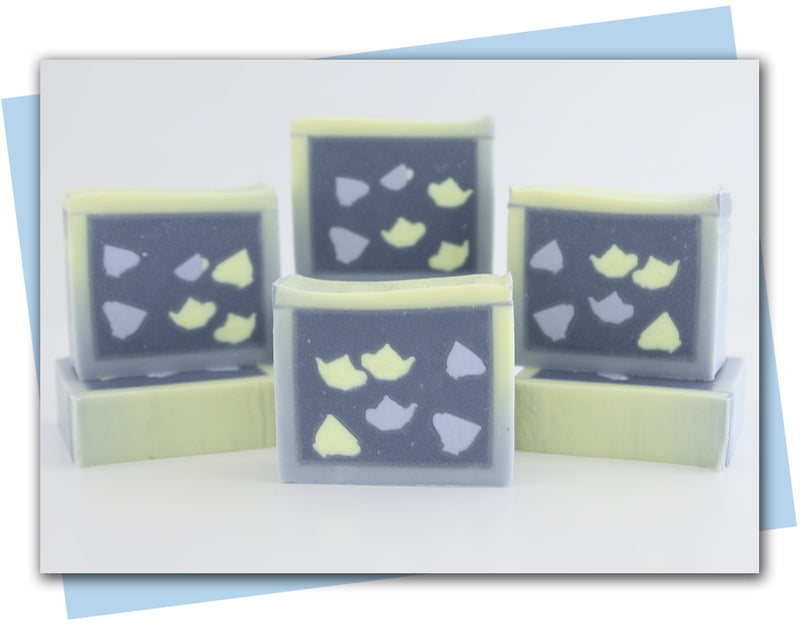 blue to yellow ombre frame with tea pots and teacups in center