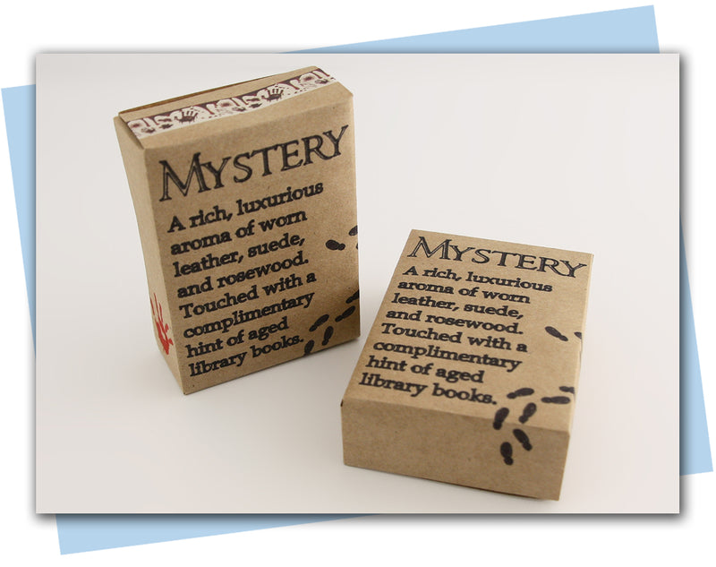 Two cardboard boxes labeled 'Mystery' with descriptive text on a light background.
