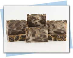 bars of soap with brown, white, and gold swirl and pecan top emneds