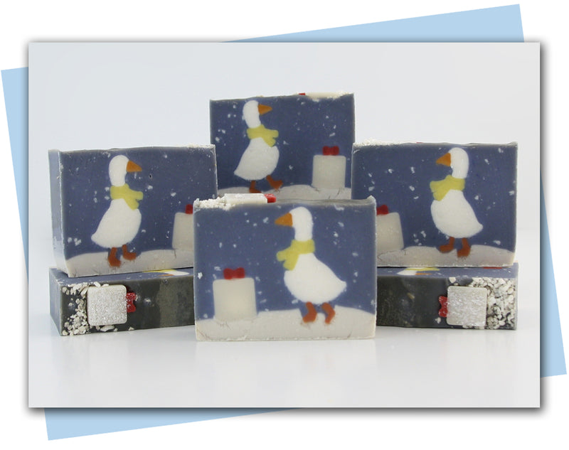Soaps with a winter duck wearing a scarf in a snow storm