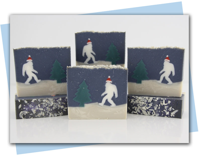 Yeti wearing santa hat walking through forest soap