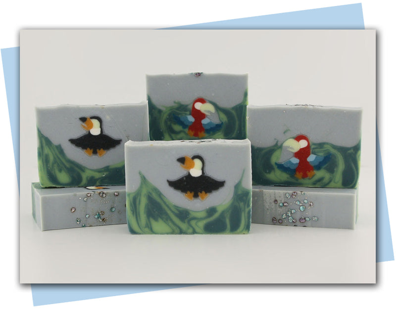 Bars of soap with a red or black parrot in them