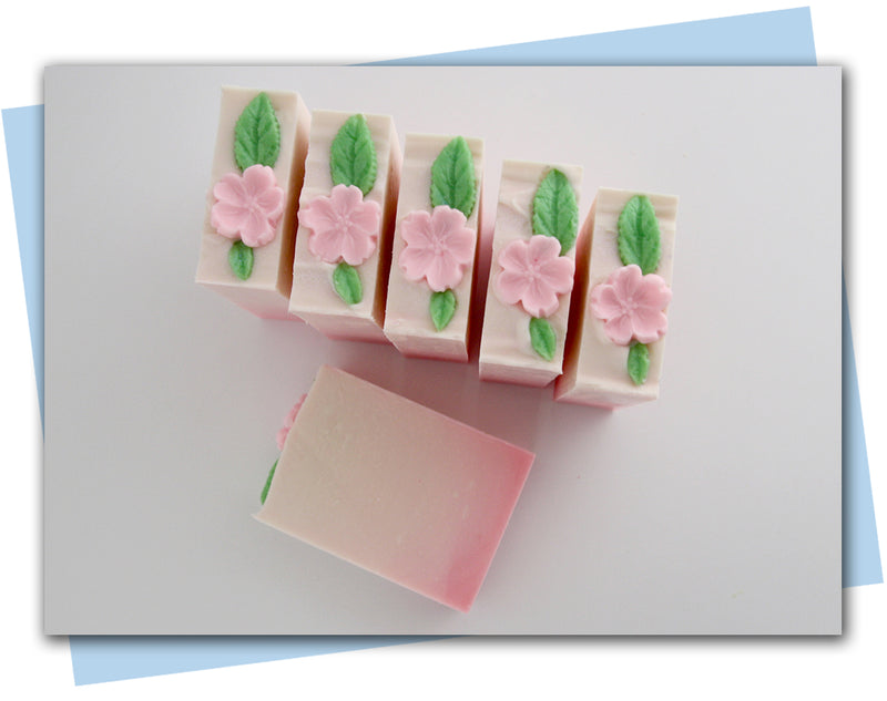 pink to white ombre base with pink flower on top bar soap