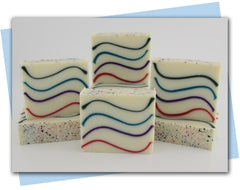 pink purple blue green waves in a white base soap bar desing