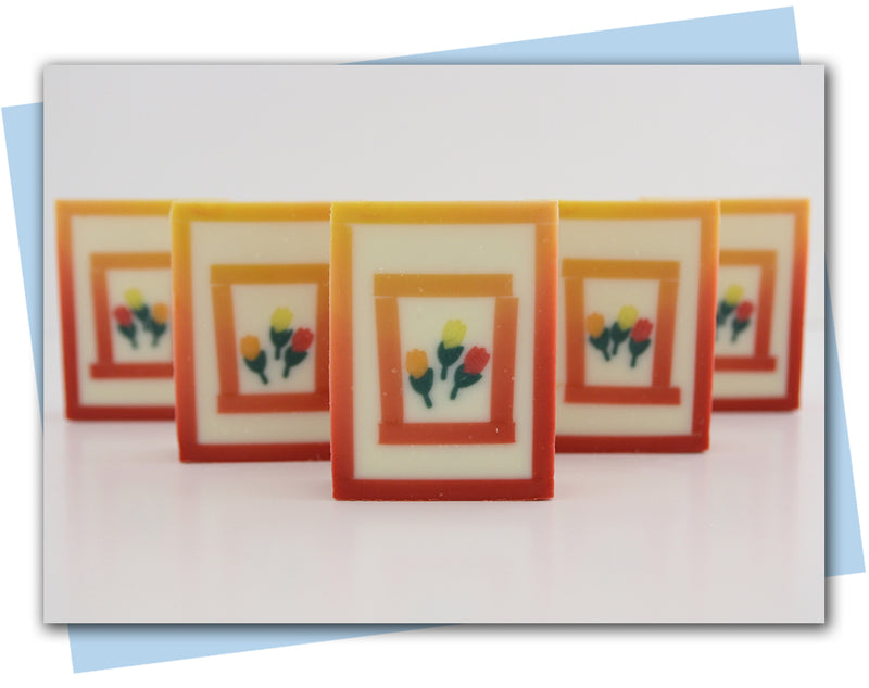 red/orange ombre frame with tulip embeds bar of soap