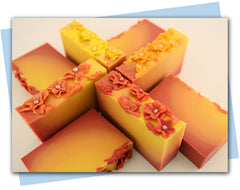 Ombre bars of soap from red to yellow ombre with flowers on top 