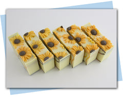 brown/orange/yellow ombre waves in a yellow base soap with sunflowers on top