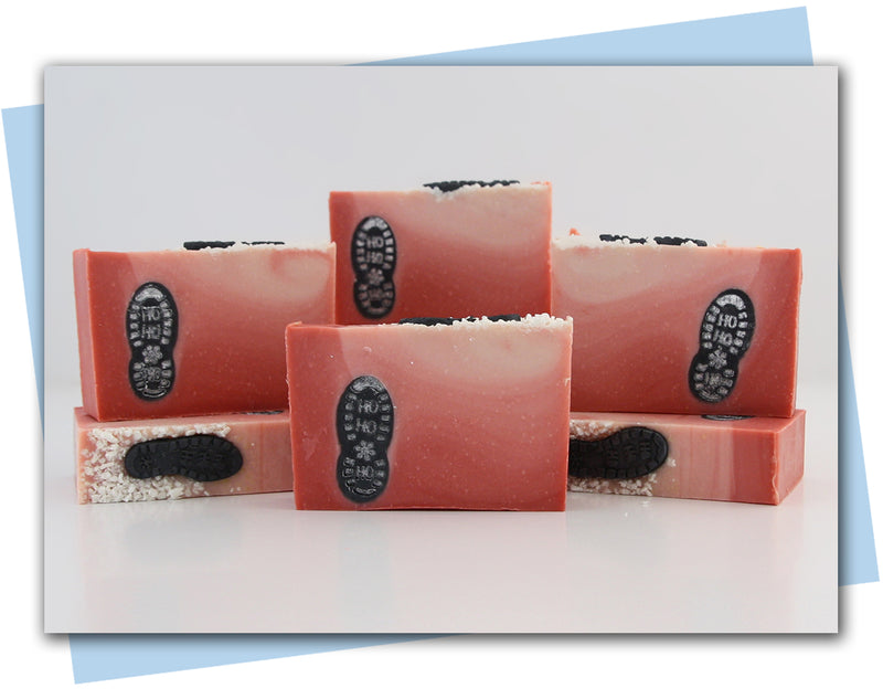 Red to white ombre soap design with santa's boot print embed