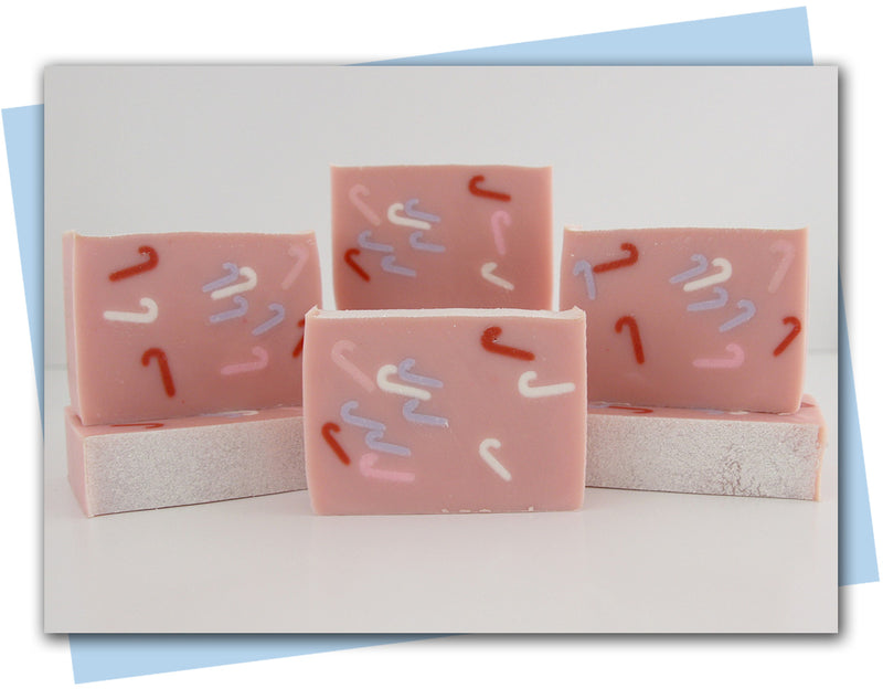pink bar of soap with mini candy canes throughout