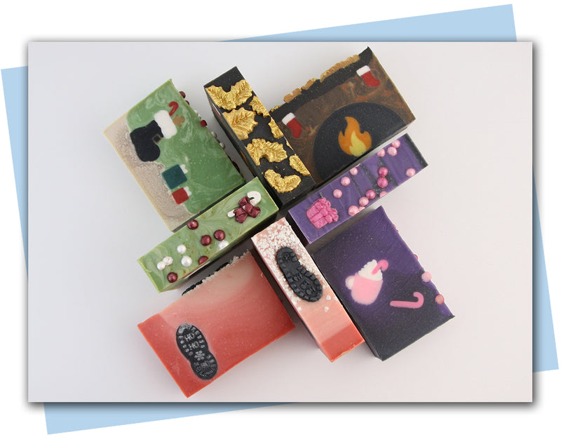 bars of soap made to look like a fireplace mantel with stockings hanging over it