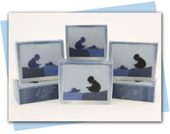 a silhouette design of a boy playing with a boat and a blue ombre frame.